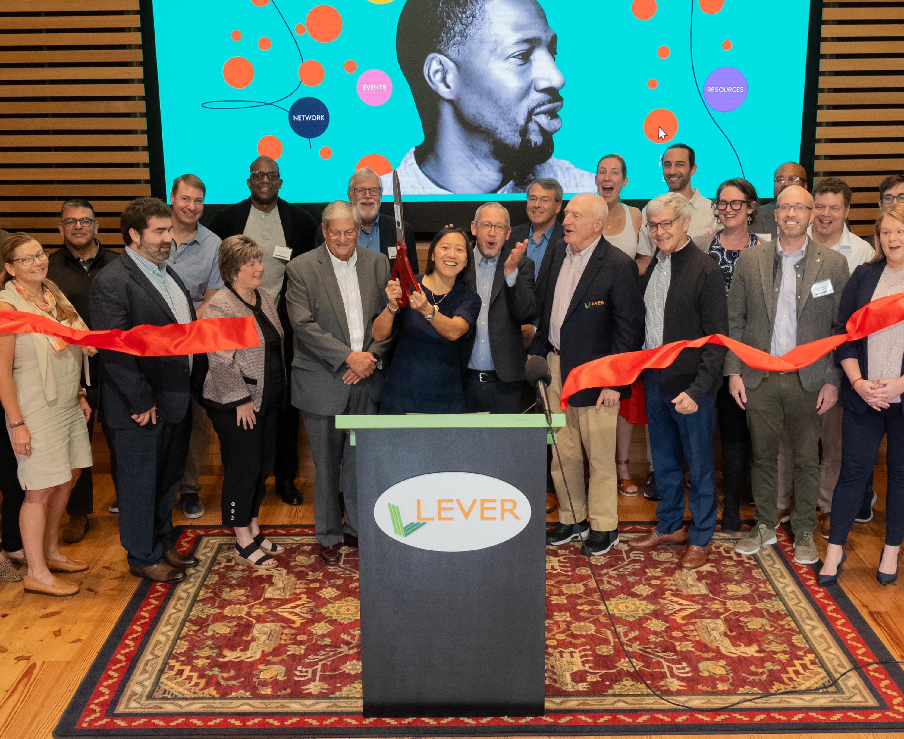 Executive Office of Economic Development (EOED) Secretary Yvonne Hao, center, Joins Lever and innovation ecosystem stakeholders from across the state for an official ribbon cutting for the Massachusetts Founders Network. Eric Korenman photo)